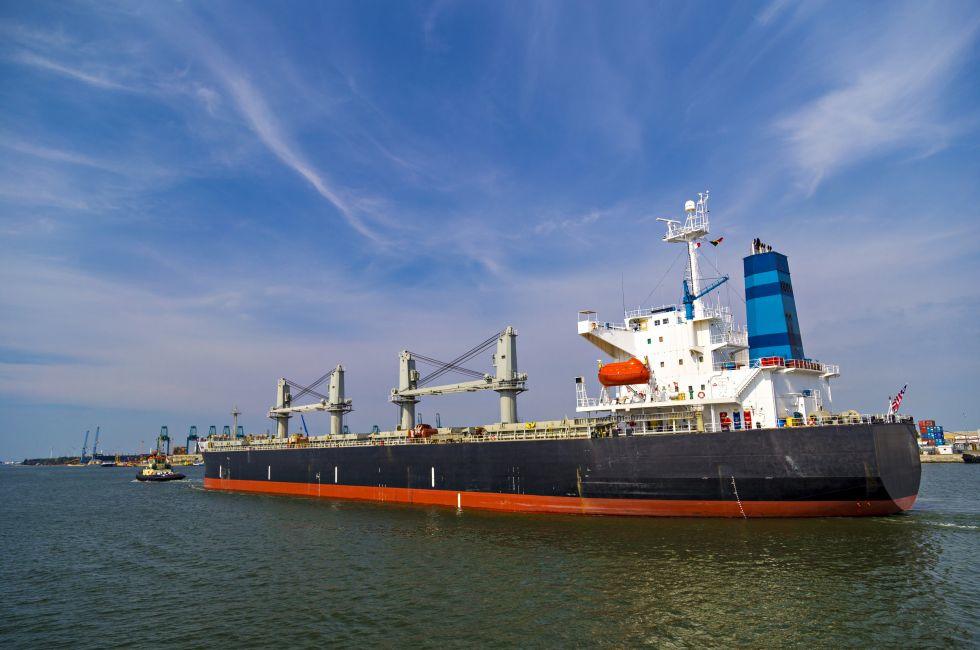 Container ship leaving the container terminal in Port of Antwerp, Belgium.