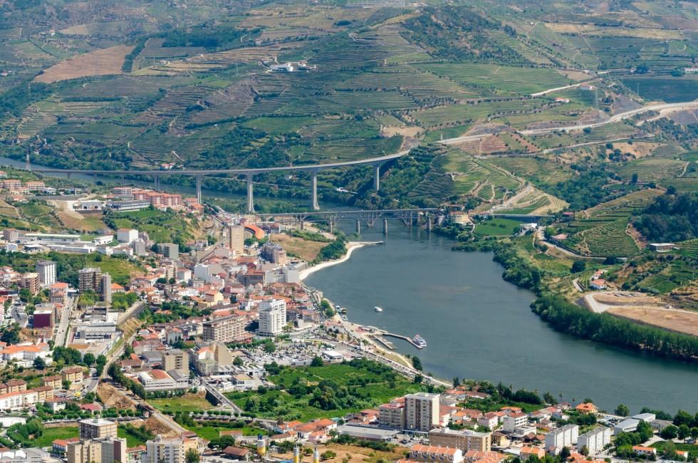 Regua, Portugal; Regua, Terraced vineyards in Douro Valley, Alto Douro Wine Region in northern Portugal, officially designated by UNESCO as World Heritage Site; 