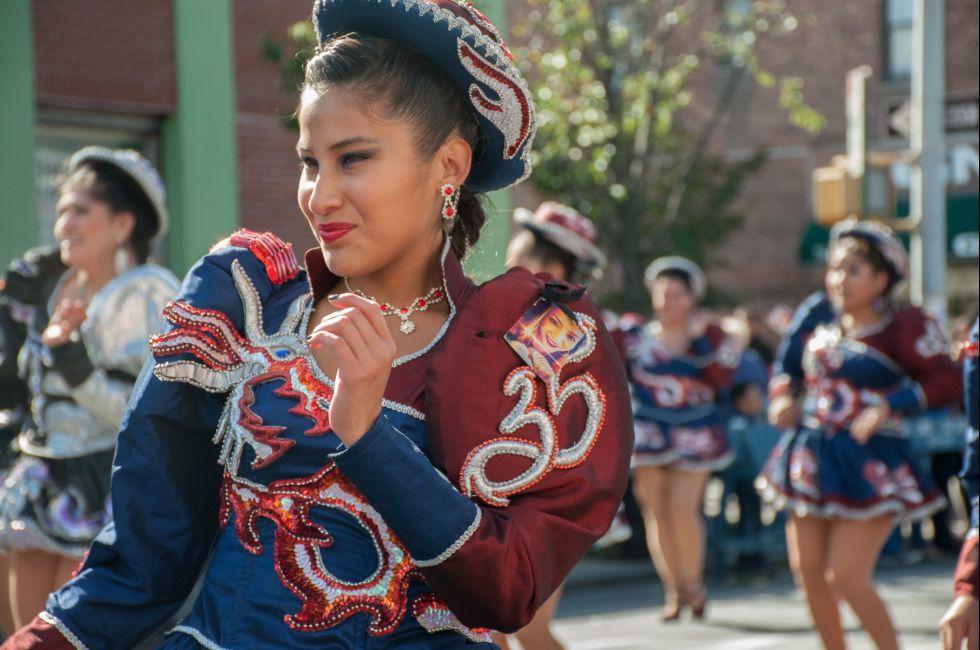 Woman performing in traditional costume in Bolivian parade, Jackson Heights, Queens, New York.