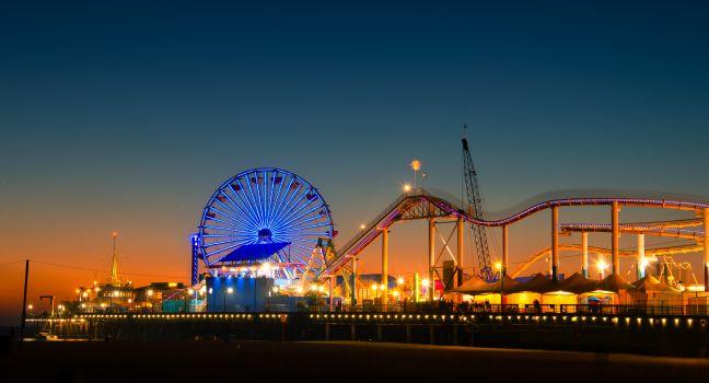 Ferris wheel on Santa Monica Pier lit up at dusk, Santa Monica, Los Angeles County, California, USA.