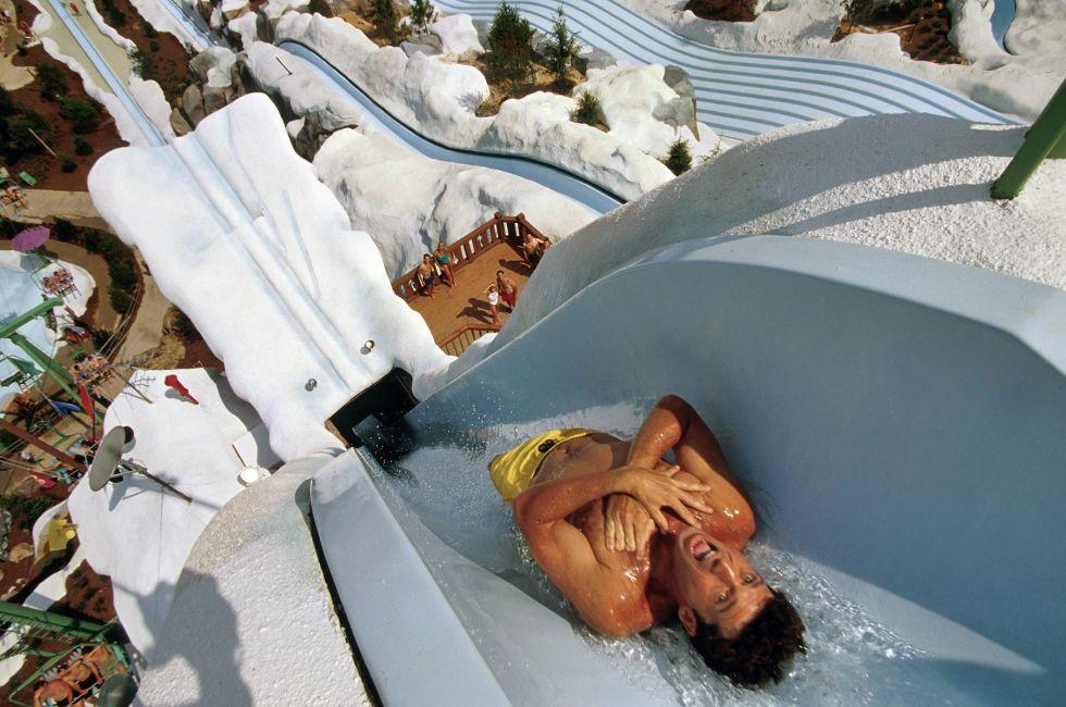 TAKING THE PLUNGE: Swimmers head almost straight down Summit Plummet at 55 mph at Disney’s Blizzard Beach water park.